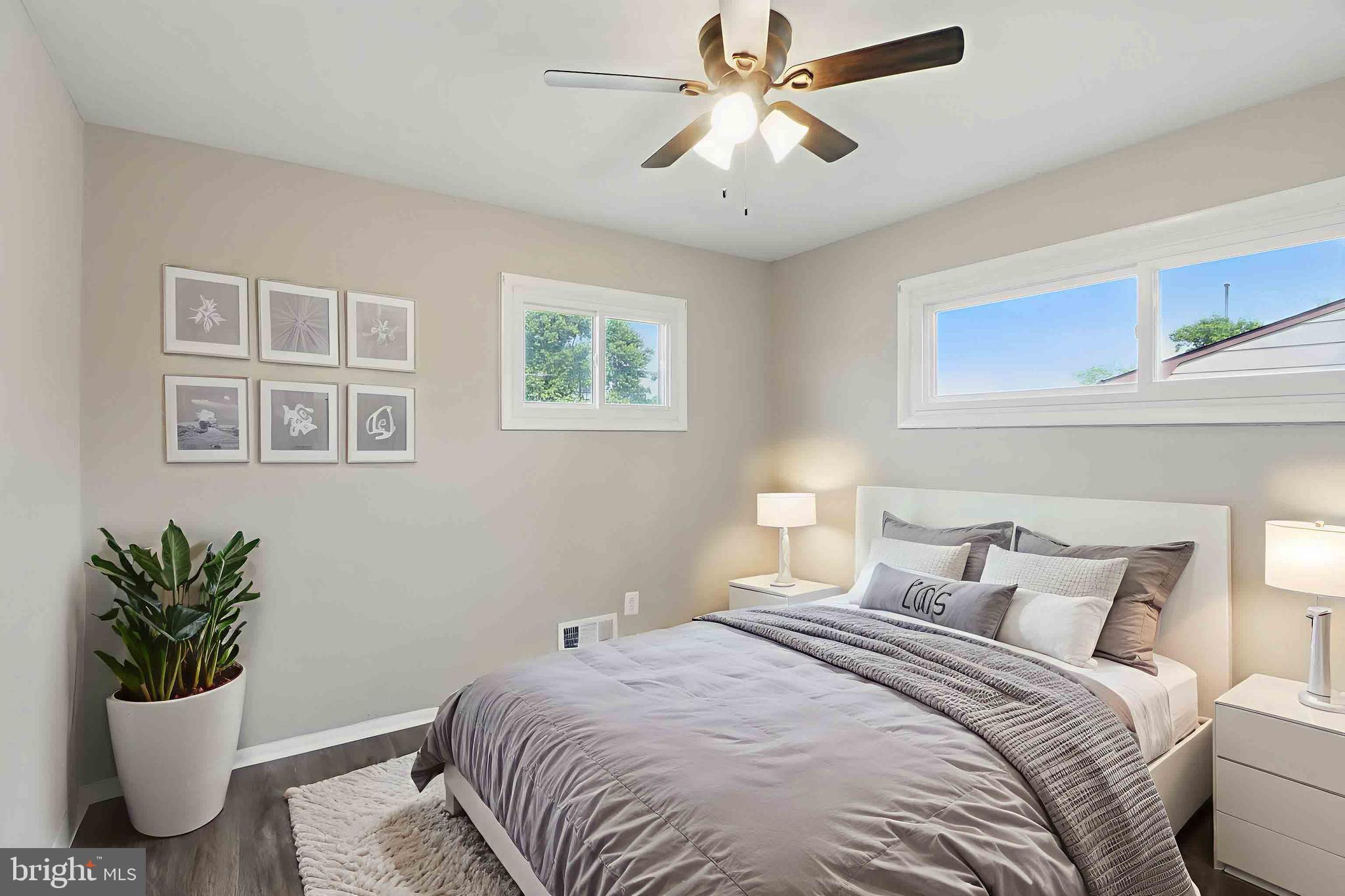 9021 Meadow Heights Road Randallstown, MD 21133 - Photo 16 of 41 a bedroom with a bed and ceiling fan