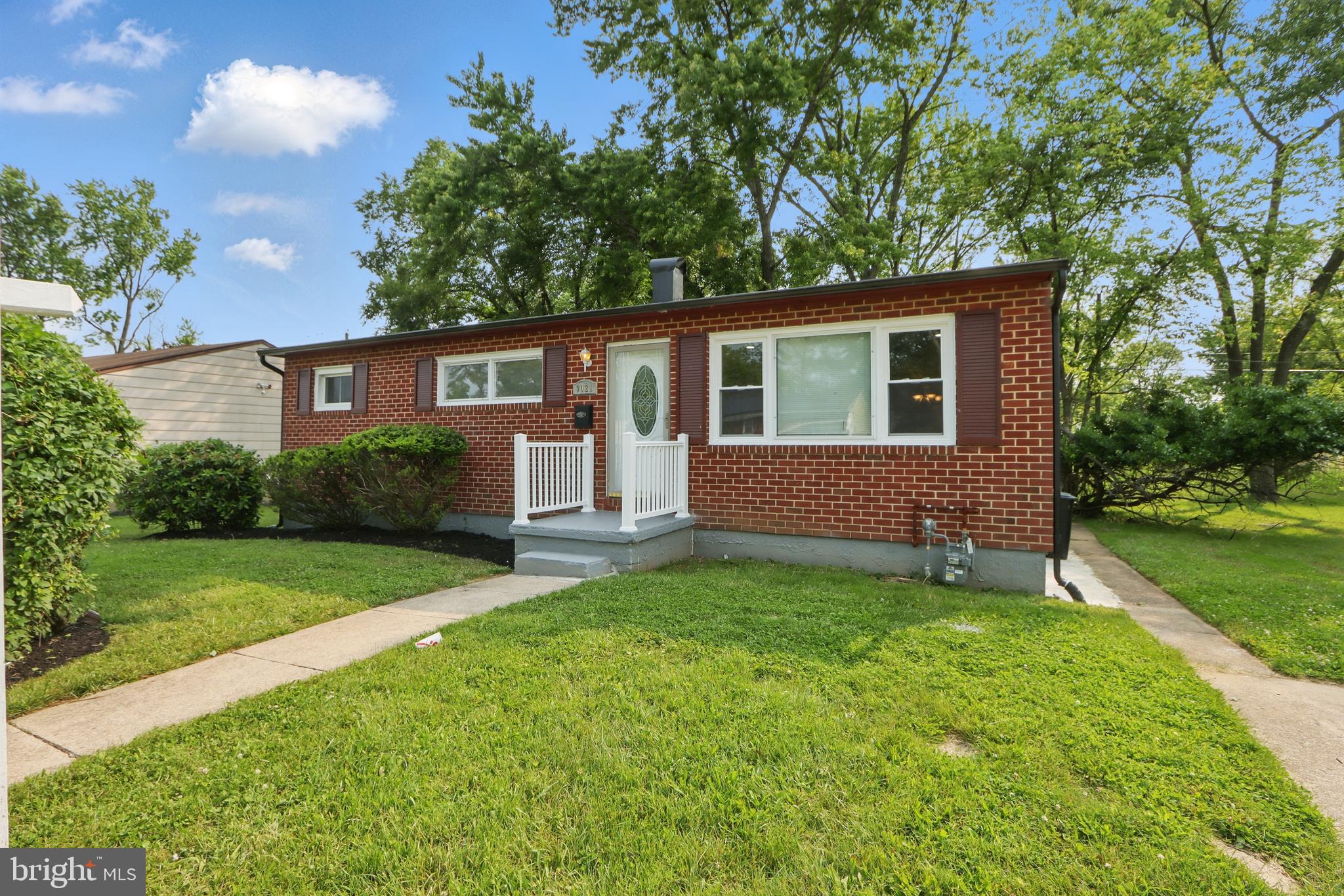 9021 Meadow Heights Road Randallstown, MD 21133 - Photo 2 of 41 front view of a house with a yard