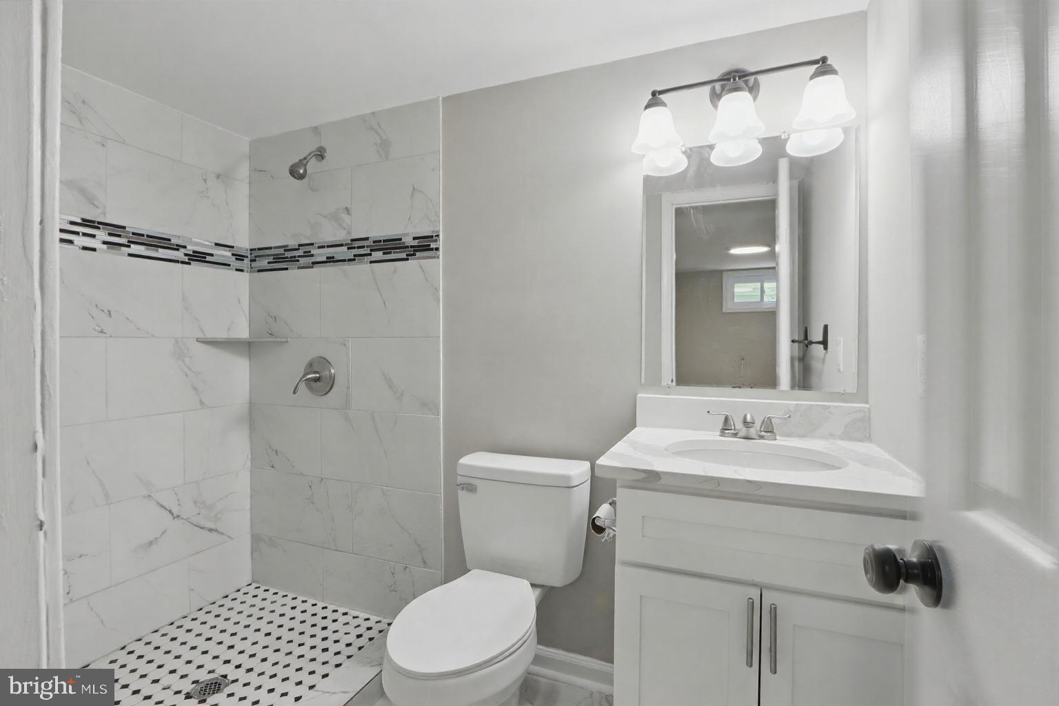 9021 Meadow Heights Road Randallstown, MD 21133 - Photo 34 of 41 a bathroom with a sink toilet and shower