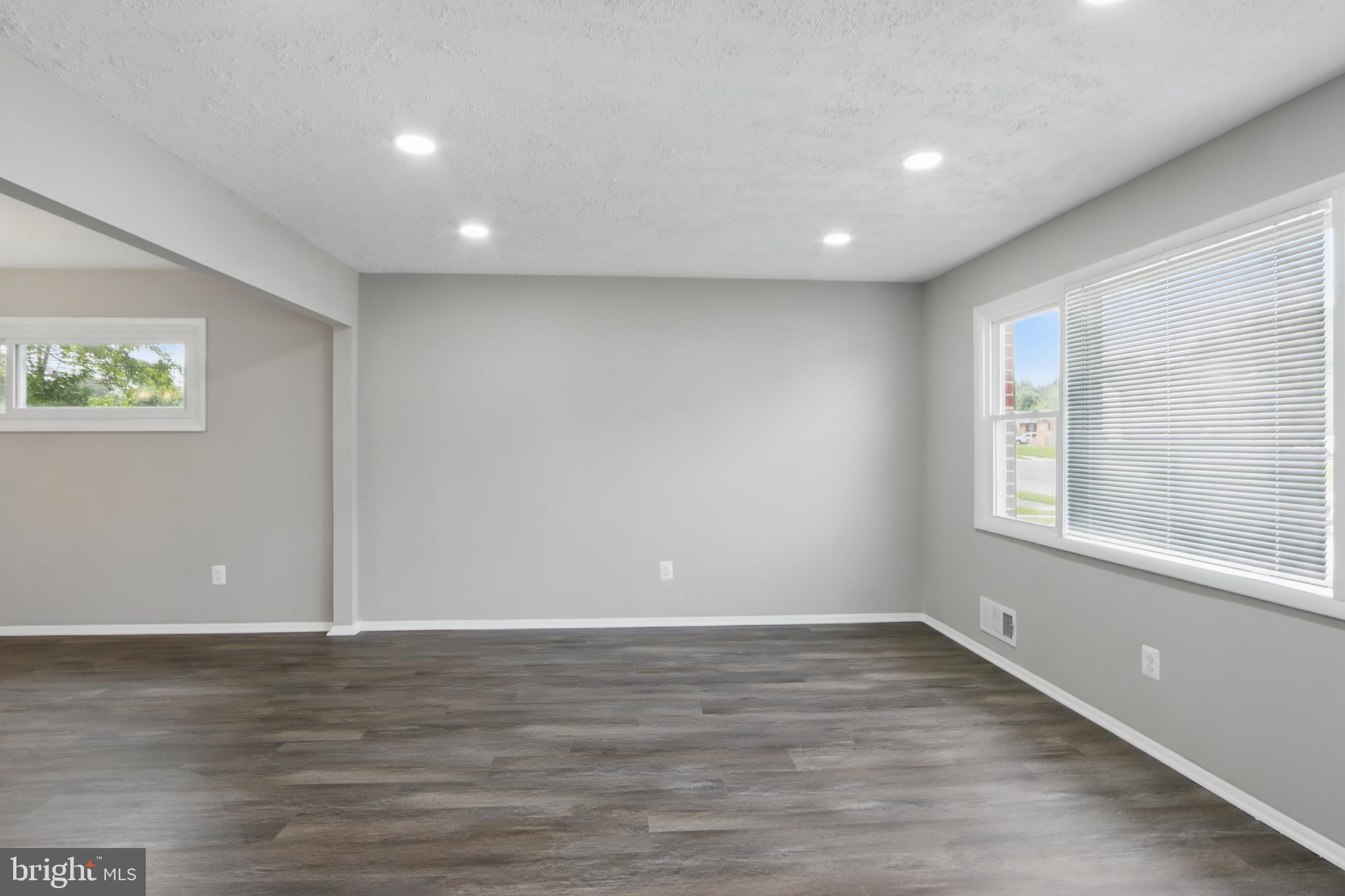 9021 Meadow Heights Road Randallstown, MD 21133 - Photo 6 of 41 a view of room with window and wooden floor