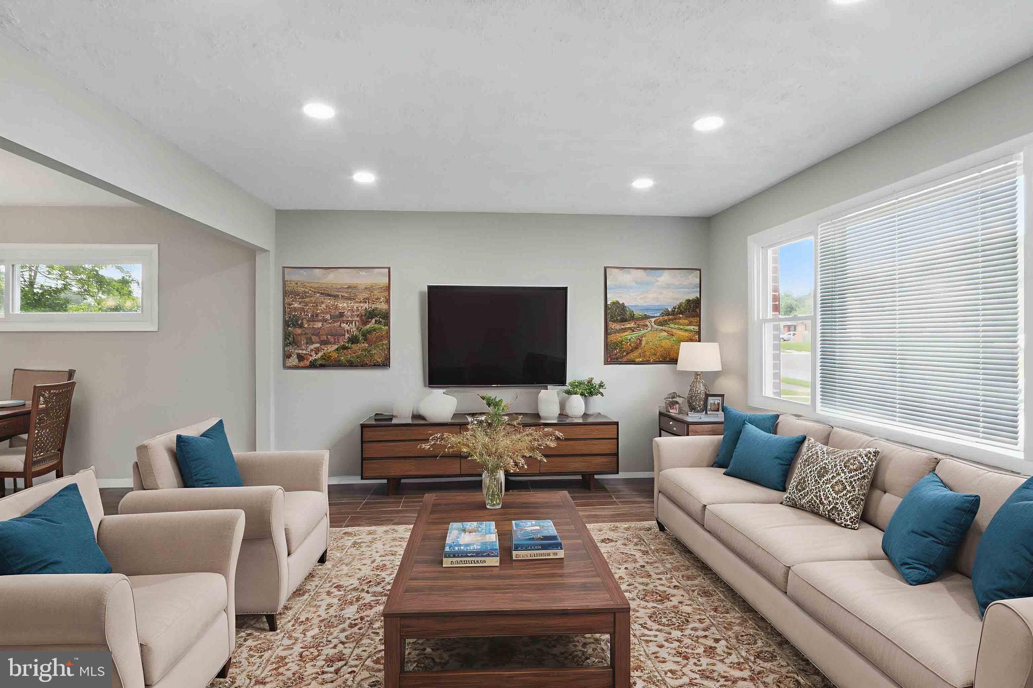 9021 Meadow Heights Road Randallstown, MD 21133 - Photo 8 of 41 a living room with furniture and a flat screen tv