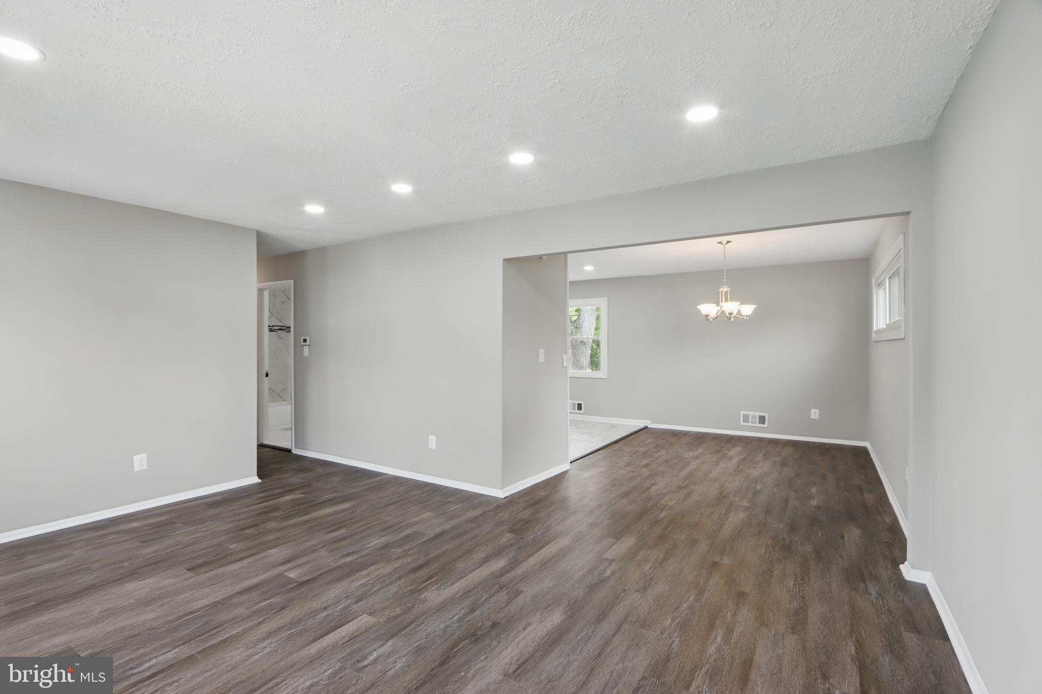 9021 Meadow Heights Road Randallstown, MD 21133 - Photo 9 of 41 a view of an empty room with wooden floor and closet