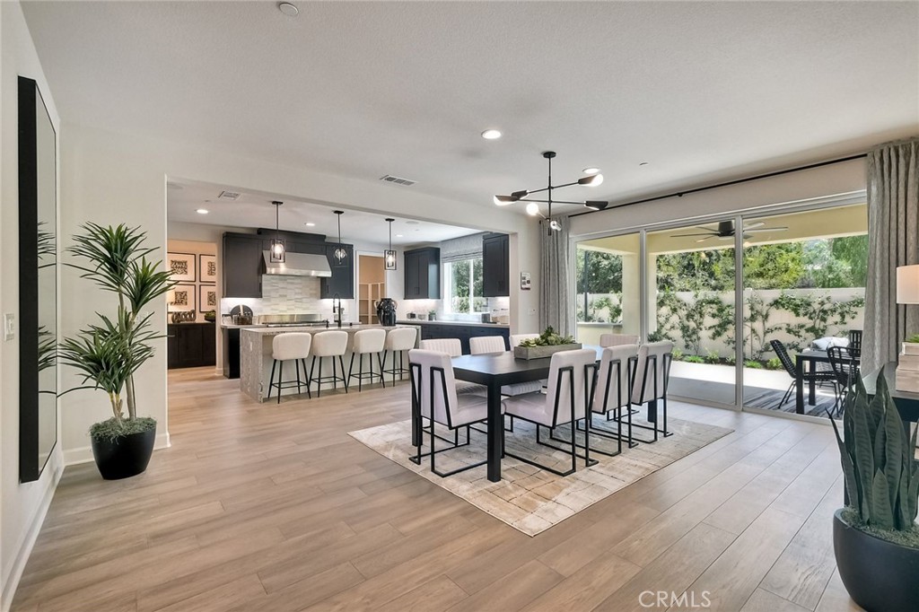 3131 Orchard Glen Escondido, CA 92026 - Photo 12 of 35 a living room with furniture potted plant floor to ceiling window and potted plants