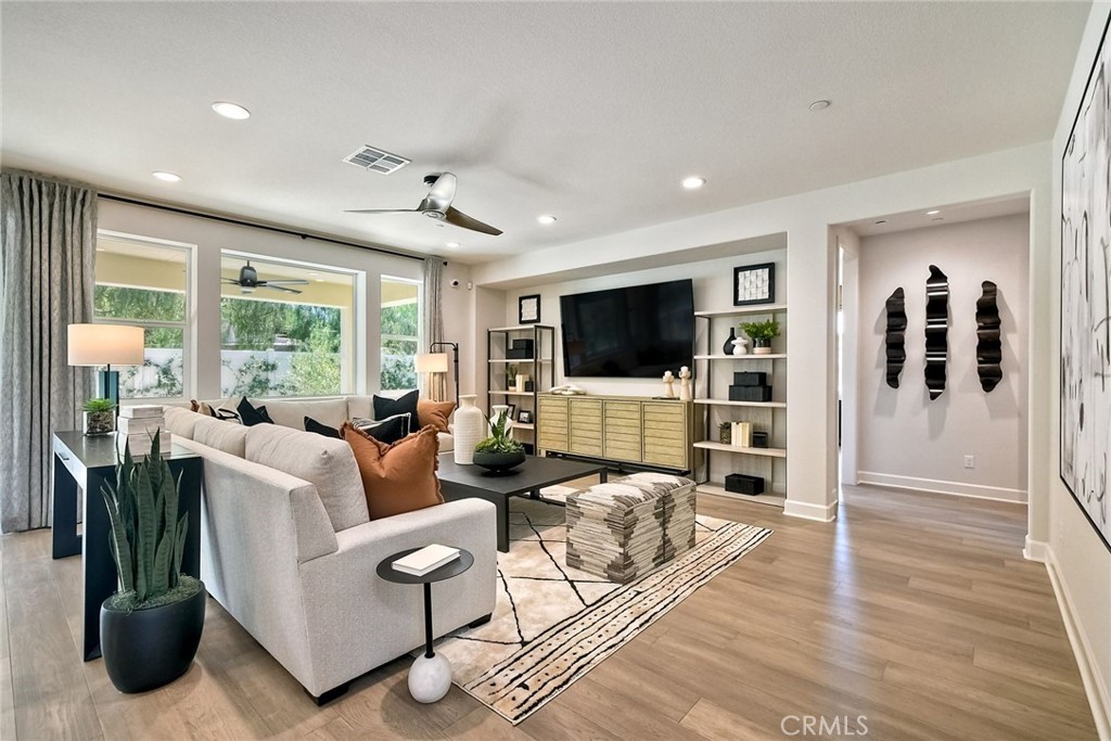 3131 Orchard Glen Escondido, CA 92026 - Photo 13 of 35 a living room with furniture and a flat screen tv