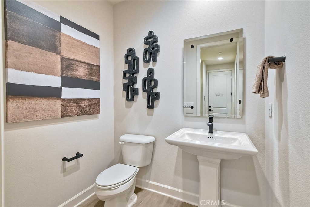 3131 Orchard Glen Escondido, CA 92026 - Photo 15 of 35 a bathroom with a sink a toilet and shower