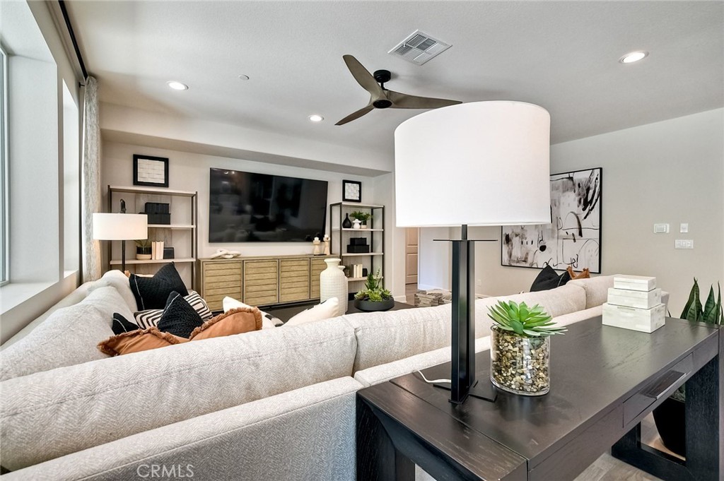 3131 Orchard Glen Escondido, CA 92026 - Photo 17 of 35 a living room with furniture and a flat screen tv