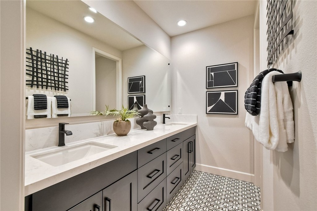 3131 Orchard Glen Escondido, CA 92026 - Photo 19 of 35 a bathroom with a double sink double vanity and a shower