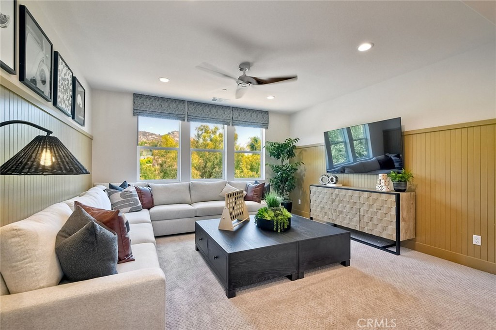 3131 Orchard Glen Escondido, CA 92026 - Photo 20 of 35 a living room with furniture and a flat screen tv