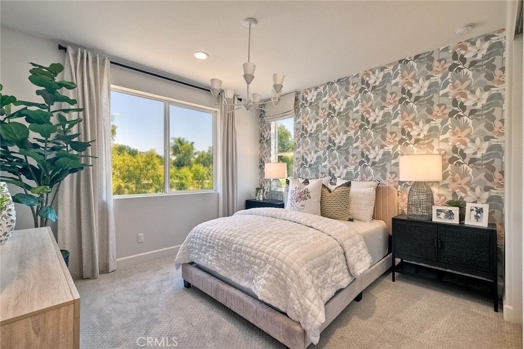 3131 Orchard Glen Escondido, CA 92026 - Photo 21 of 35 a bedroom with a large bed and a chandelier