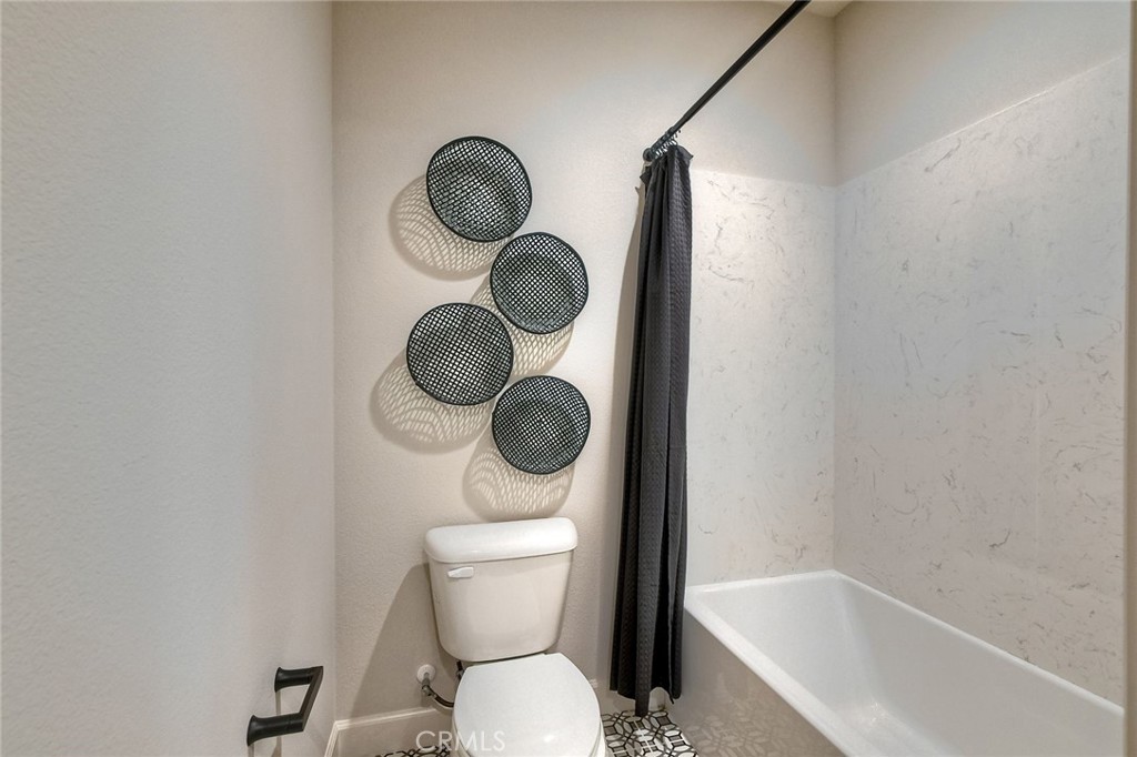 3131 Orchard Glen Escondido, CA 92026 - Photo 31 of 35 a bathroom with a toilet and a sink