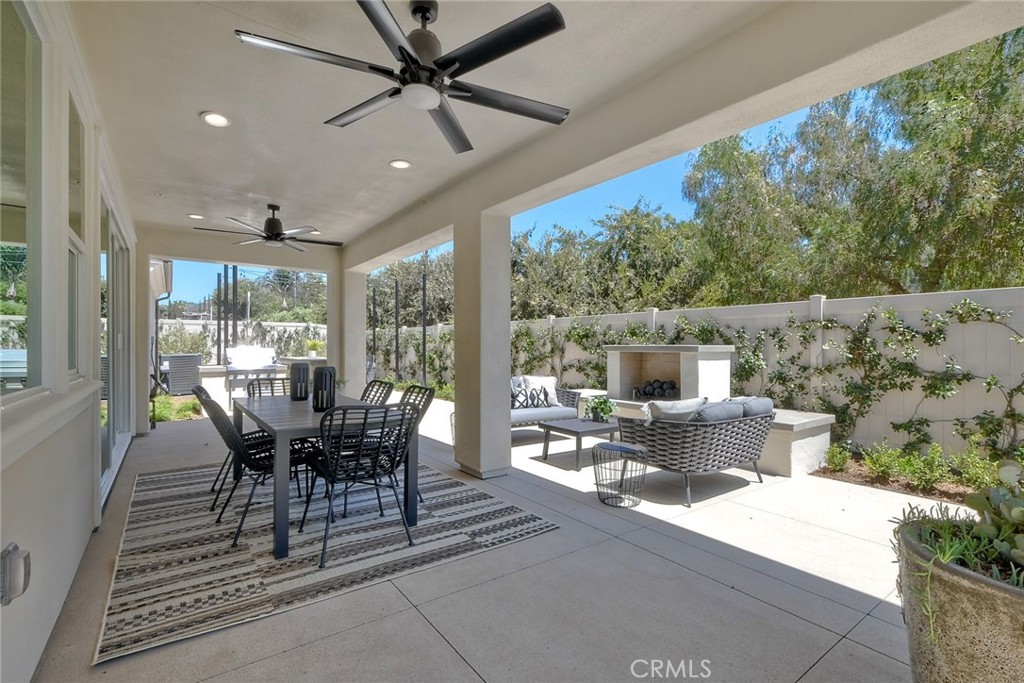 3131 Orchard Glen Escondido, CA 92026 - Photo 34 of 35 a dining room with furniture and a floor to ceiling window