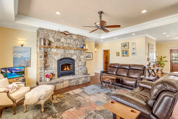 a living room with furniture and a fireplace