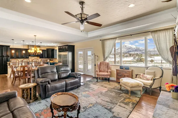 a living room with furniture and a large window