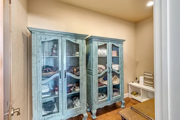 hallway with wooden floor and closet