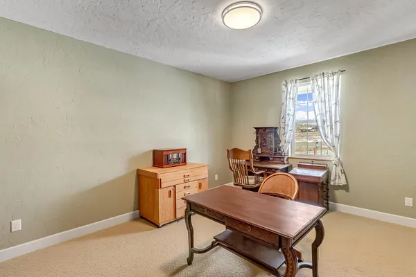 a workspace with furniture and window