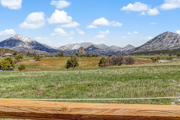 a view of an ocean and a mountain
