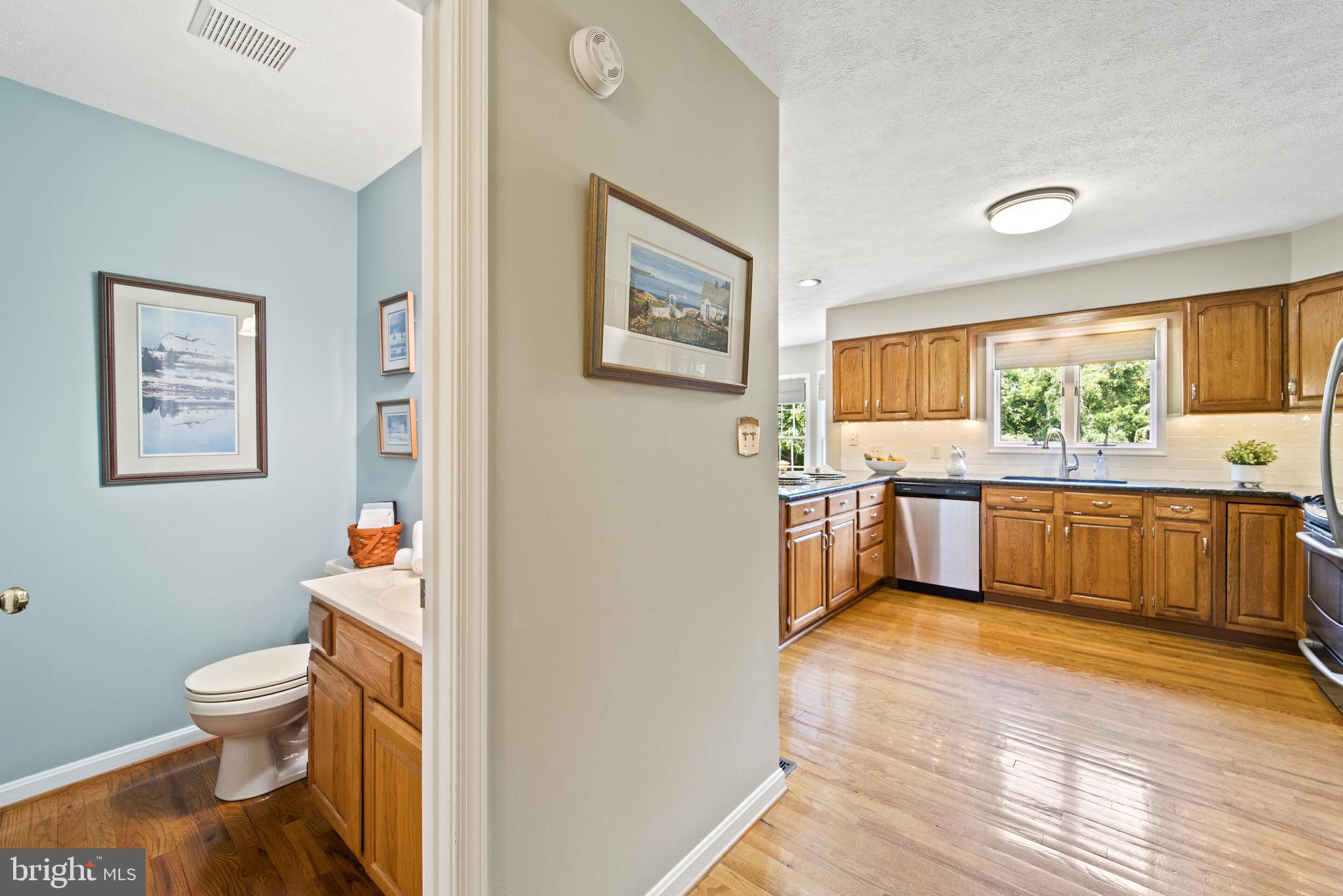 439 Kimble Road Berryville, VA 22611 - Photo 53 of 77 POWDER ROOM ON MAIN LEVEL HAS HARDWOOD FLOOR