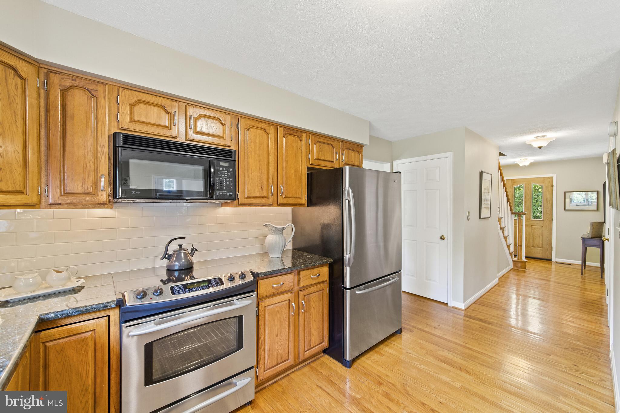 439 Kimble Road Berryville, VA 22611 - Photo 9 of 77 STAINLESS STEEL APPLIANCES AND HONEY WOOD CABINETS
