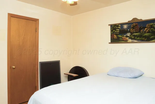 a workspace with furniture and a flat screen tv