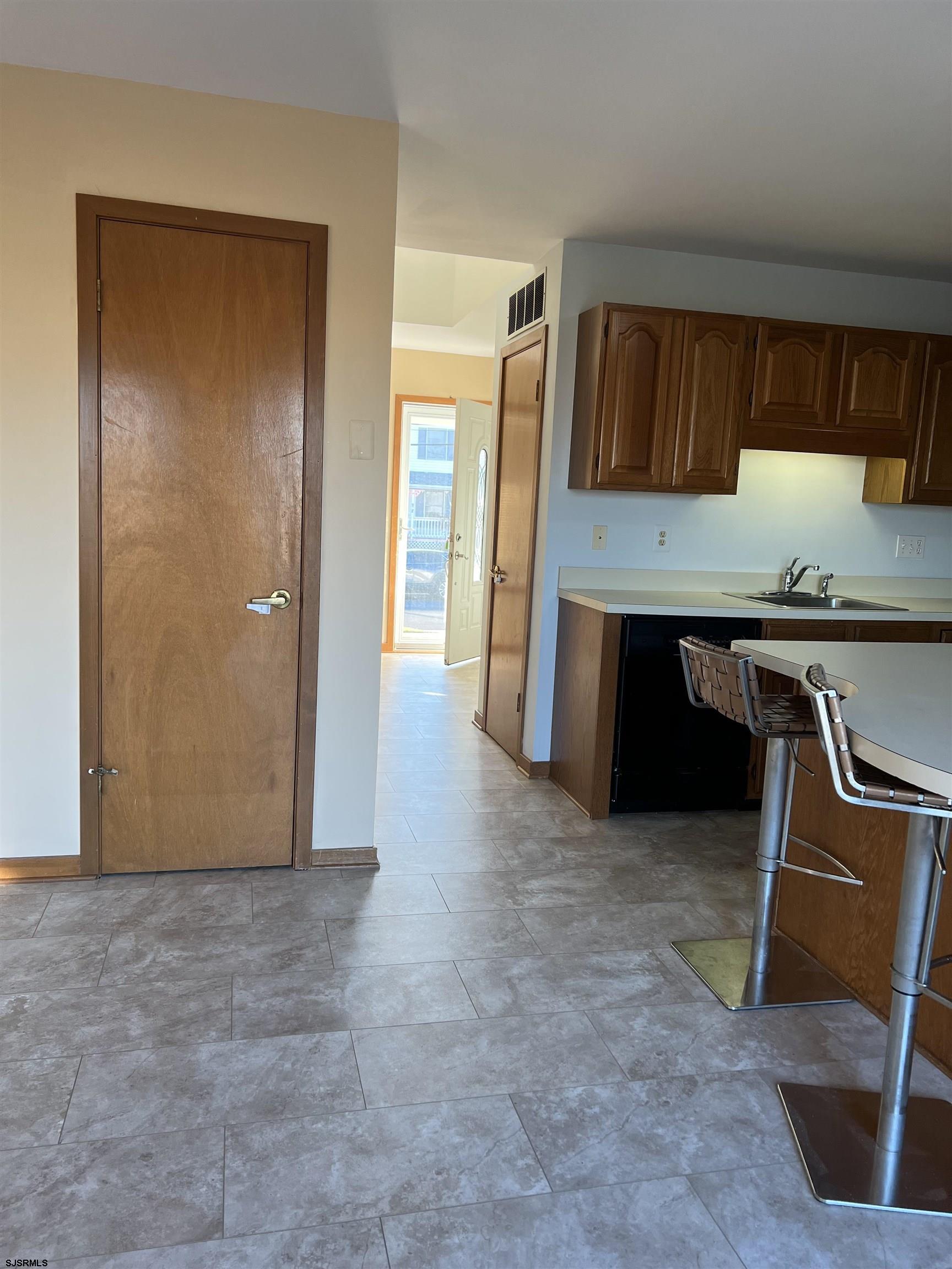 215 Hagen Road Brigantine, NJ 08203 - Photo 6 of 21 a view of kitchen with furniture and wooden floor