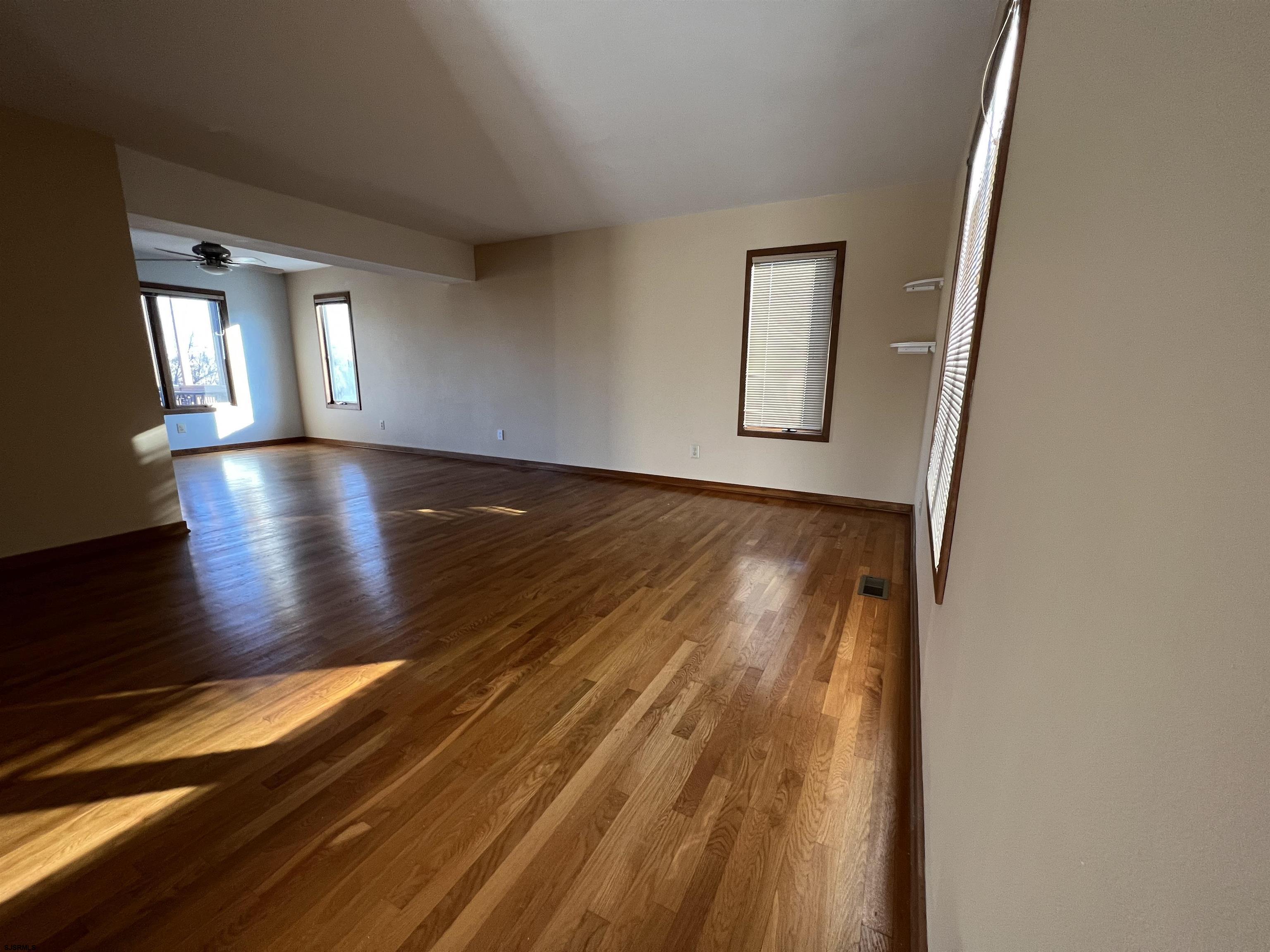 215 Hagen Road Brigantine, NJ 08203 - Photo 9 of 21 a view of livingroom with hardwood floor and hallway