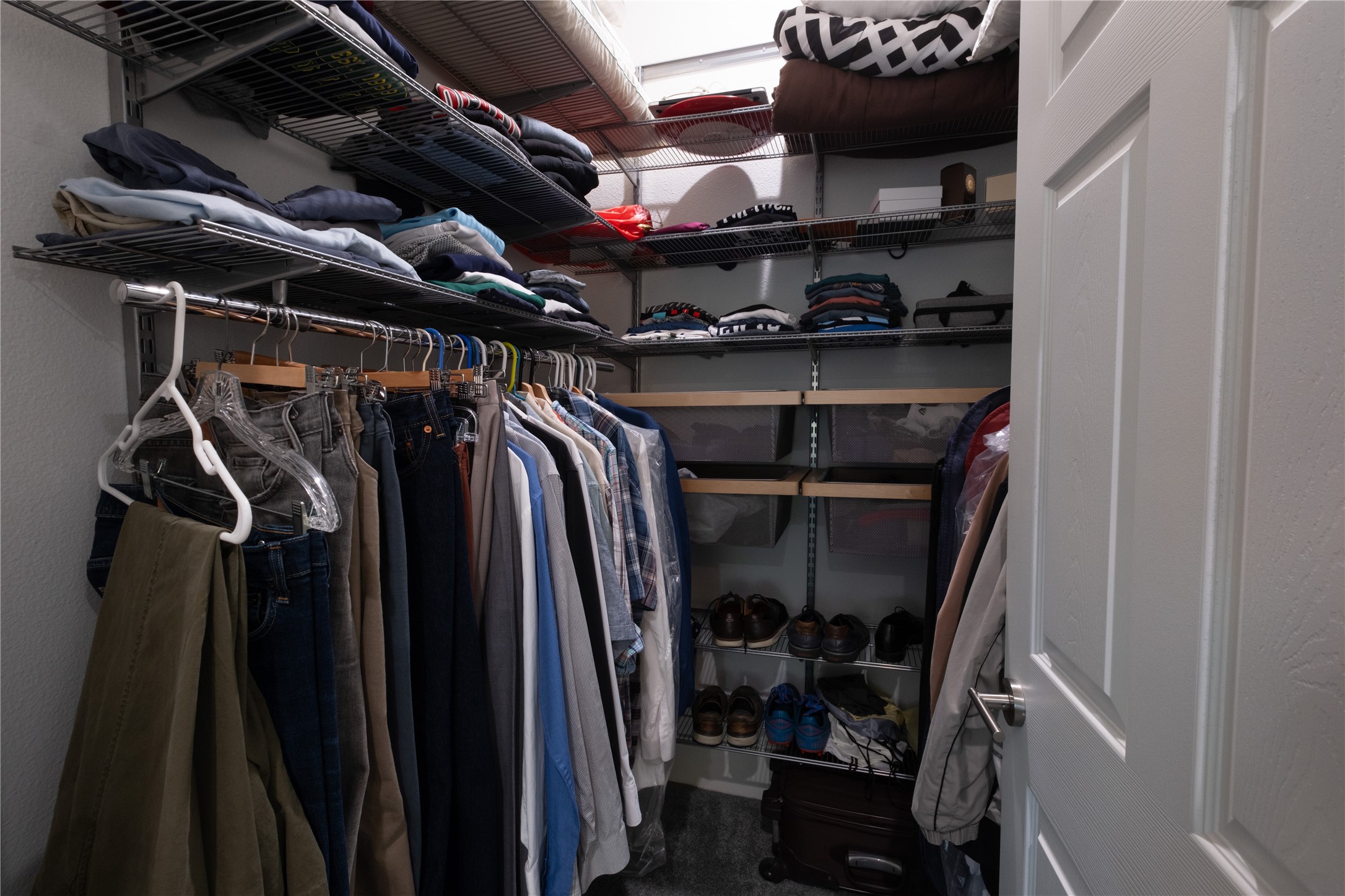 927 Highland Street Houston, TX 77009 - Photo 17 of 24 One of two primary closets with Elfa storage systems.
