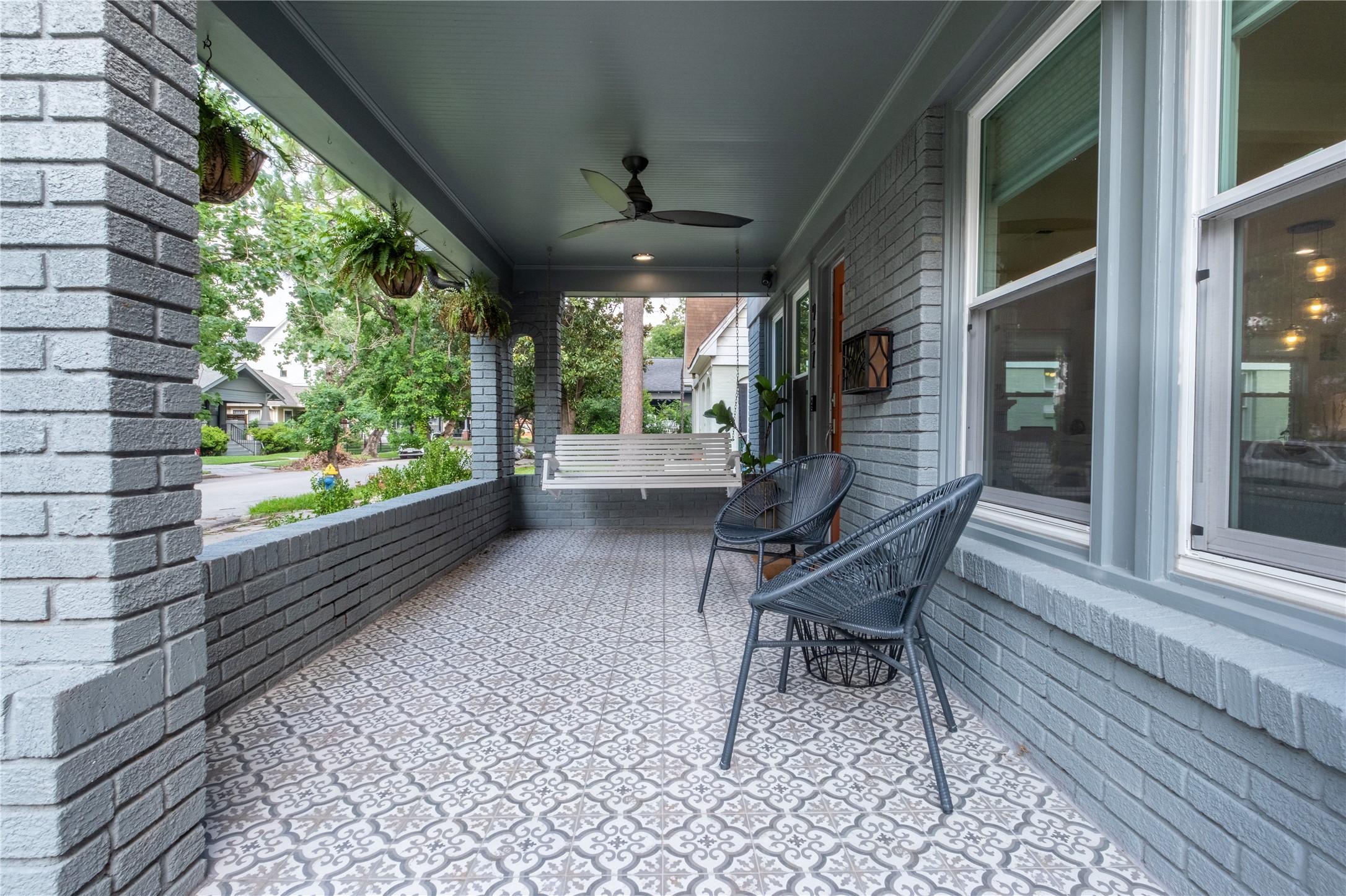 927 Highland Street Houston, TX 77009 - Photo 3 of 24 A tiled porch offers covered seating to enjoy the "front porch living" feel of the Heights.