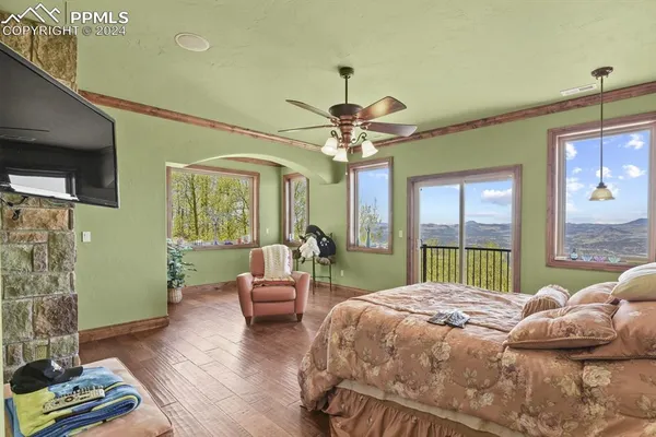 a bedroom with a bed and a mirror