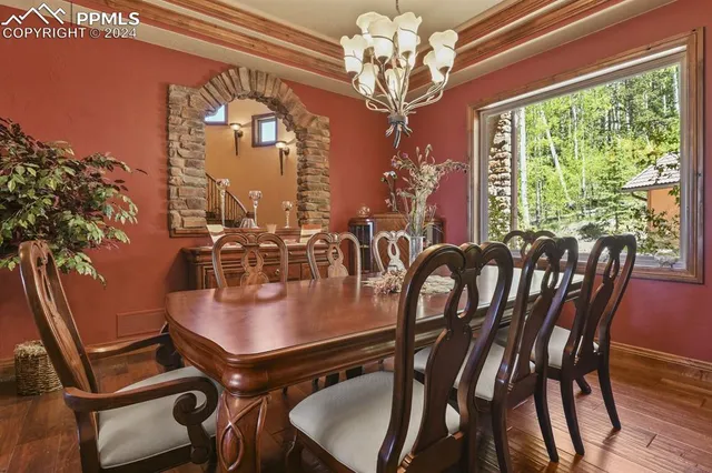 a view of a dining room with furniture window and outside view