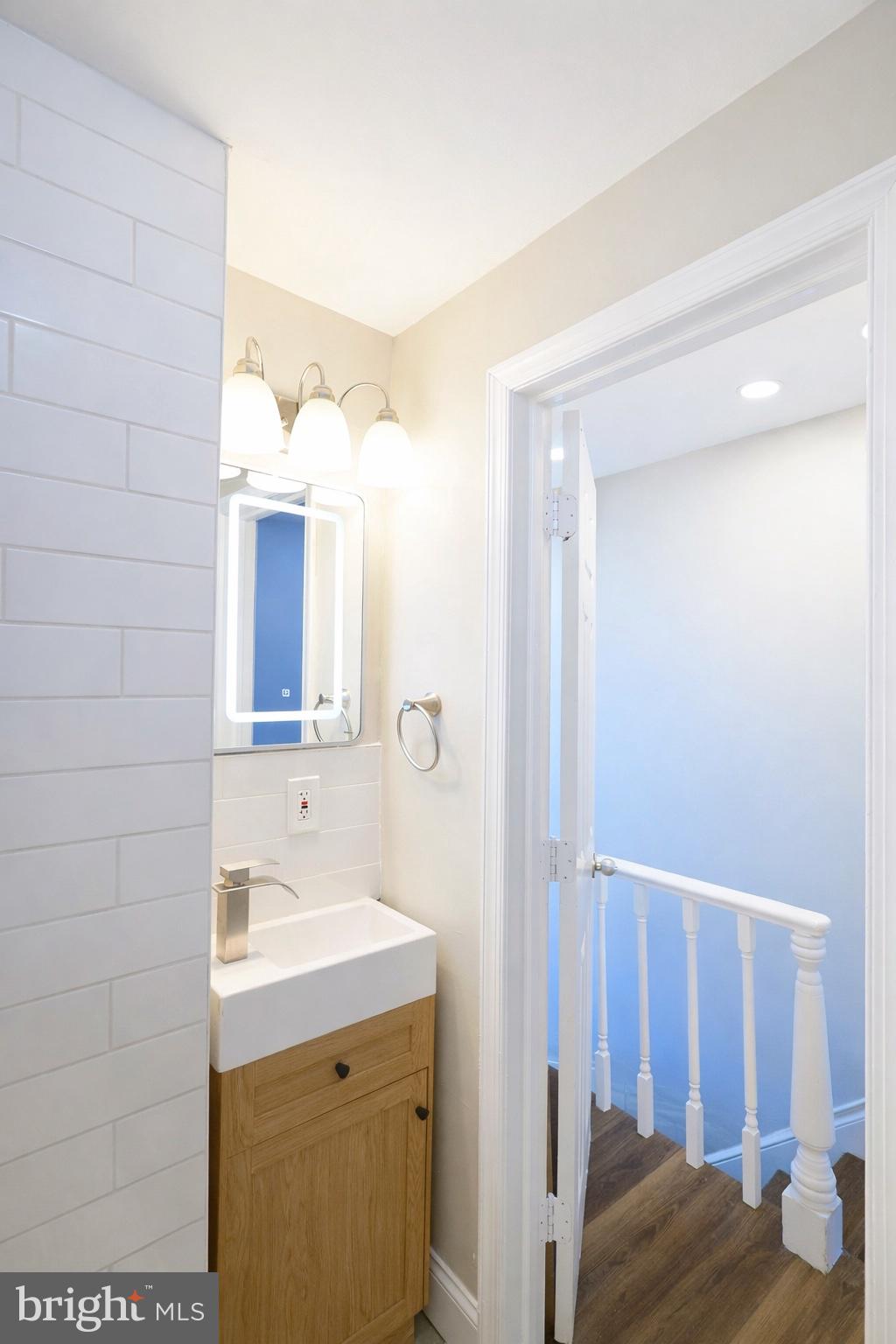 2655 Cedar Street Philadelphia, PA 19125 - Photo 13 of 22 a bathroom with a sink and a mirror