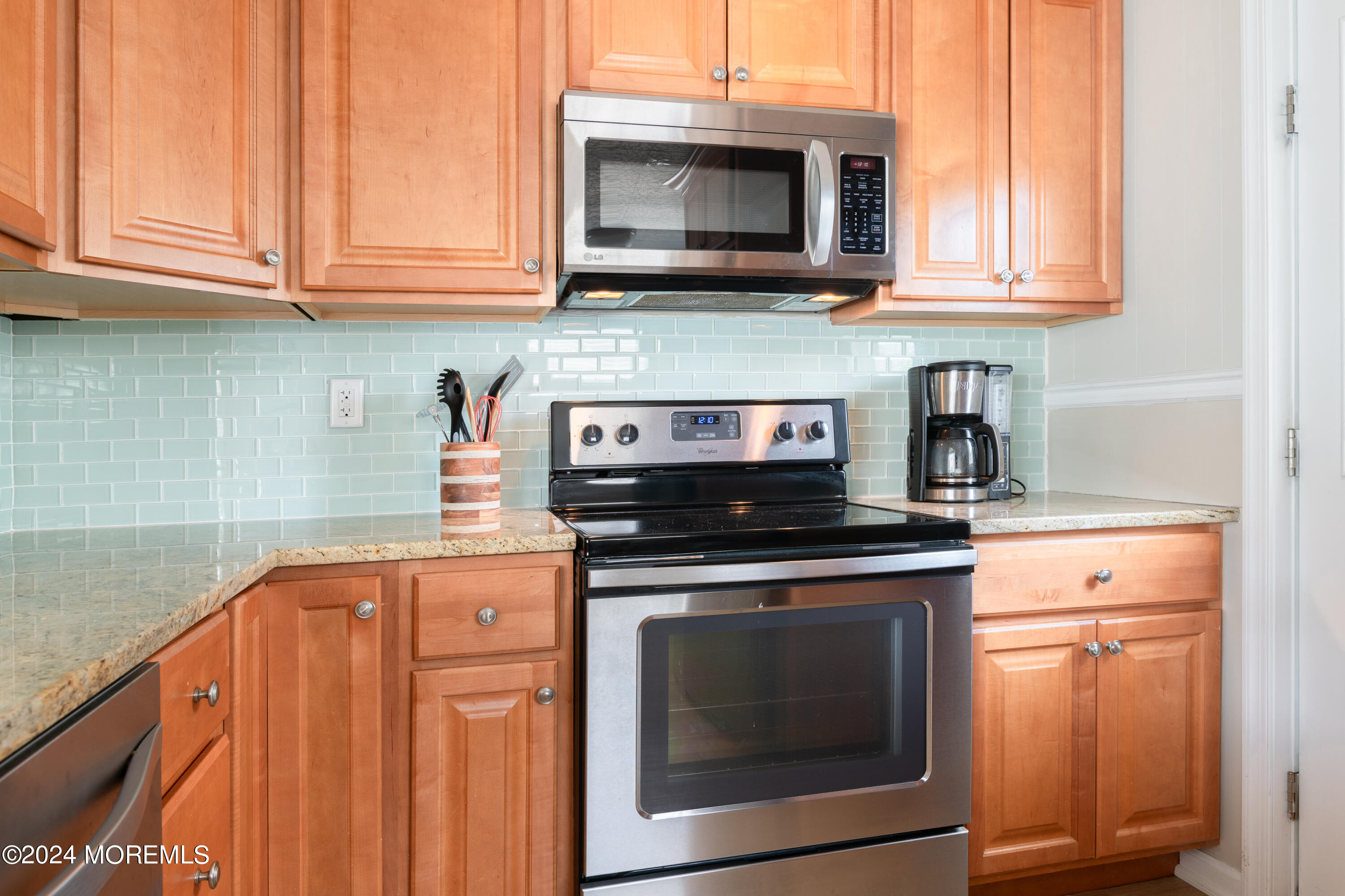 19 Via Ripa Way Sea Bright, NJ 07760 - Photo 8 of 37 a kitchen with stainless steel appliances granite countertop a stove a microwave and oven