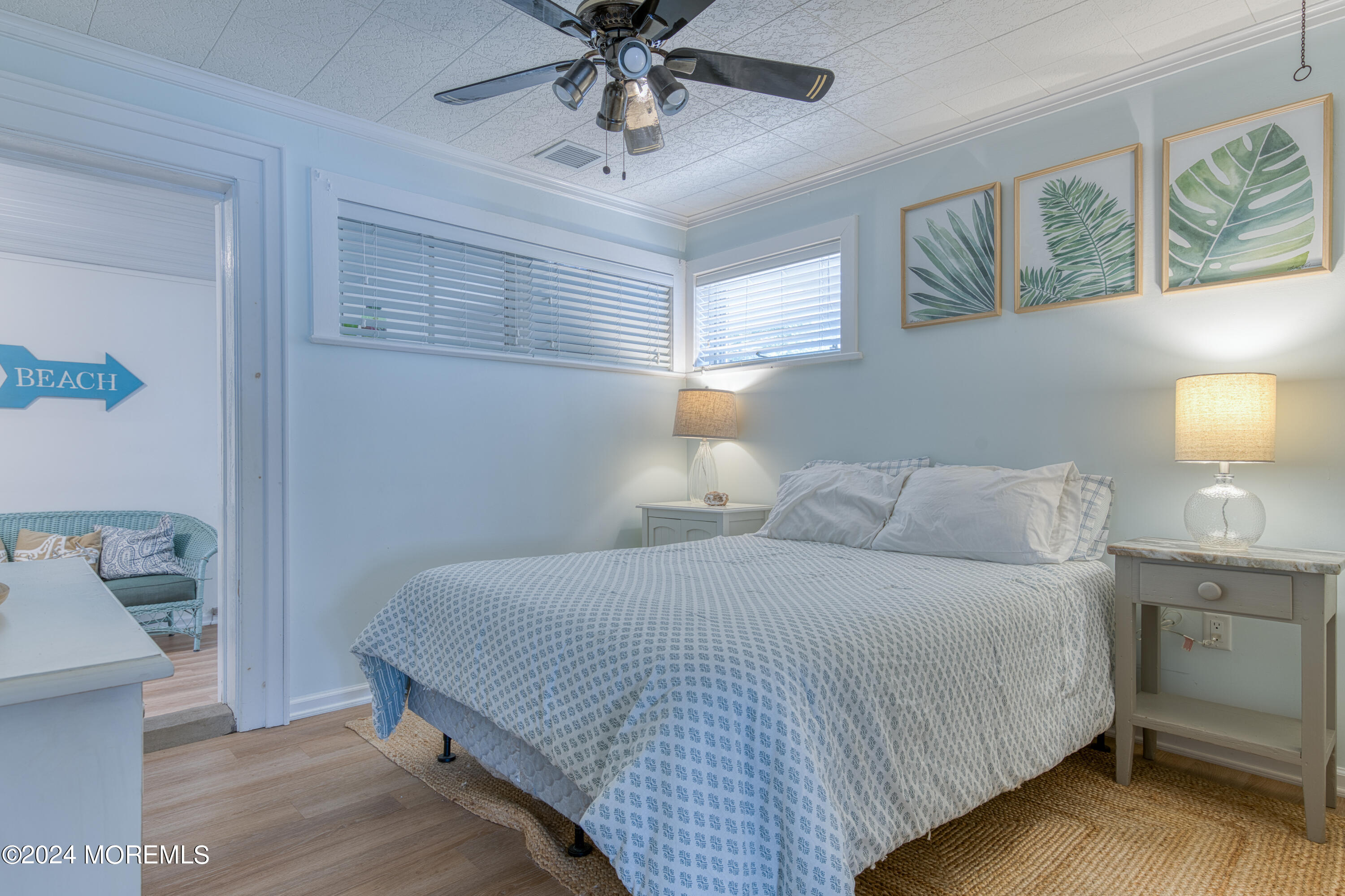 19 Via Ripa Way Sea Bright, NJ 07760 - Photo 9 of 37 a bedroom with a bed and a chandelier