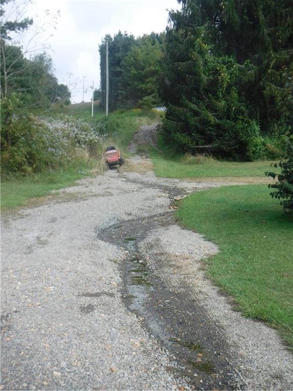 132 Pruitt Road Sparta, NC 28675 - Photo 18 of 25 This is the gravel drive up to the house site... it is washed out and only 4 wheeled drive vehicles should go up this drive