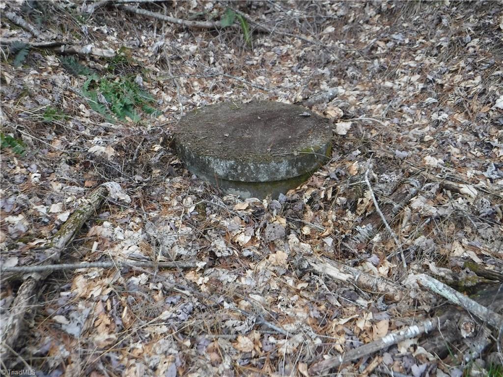 132 Pruitt Road Sparta, NC 28675 - Photo 24 of 25 The water source to the house is this concrete pipe in the spring head