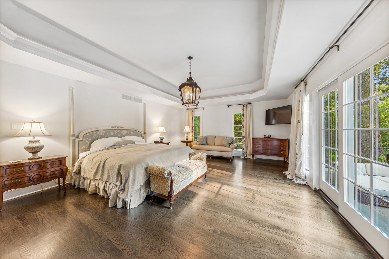 202 Burr Ridge Club Burr Ridge, IL 60527 - Photo 17 of 31 a spacious bedroom with a bed chandelier and a large window