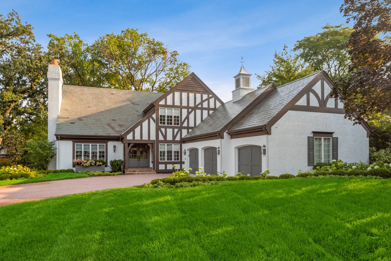 202 Burr Ridge Club Burr Ridge, IL 60527 - Photo 2 of 31 a front view of house with yard and green space