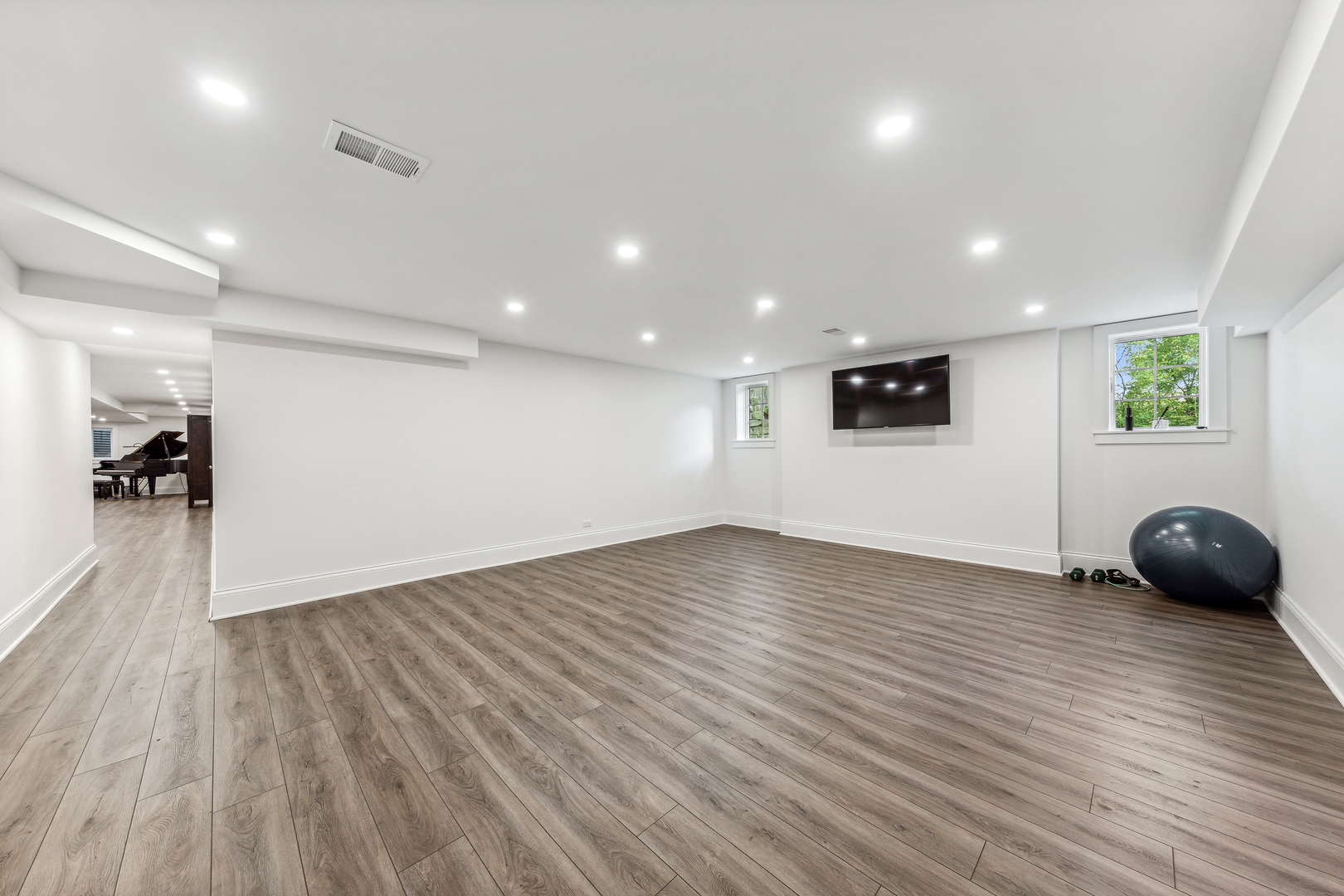 202 Burr Ridge Club Burr Ridge, IL 60527 - Photo 26 of 31 a view of a big room with wooden floor and windows