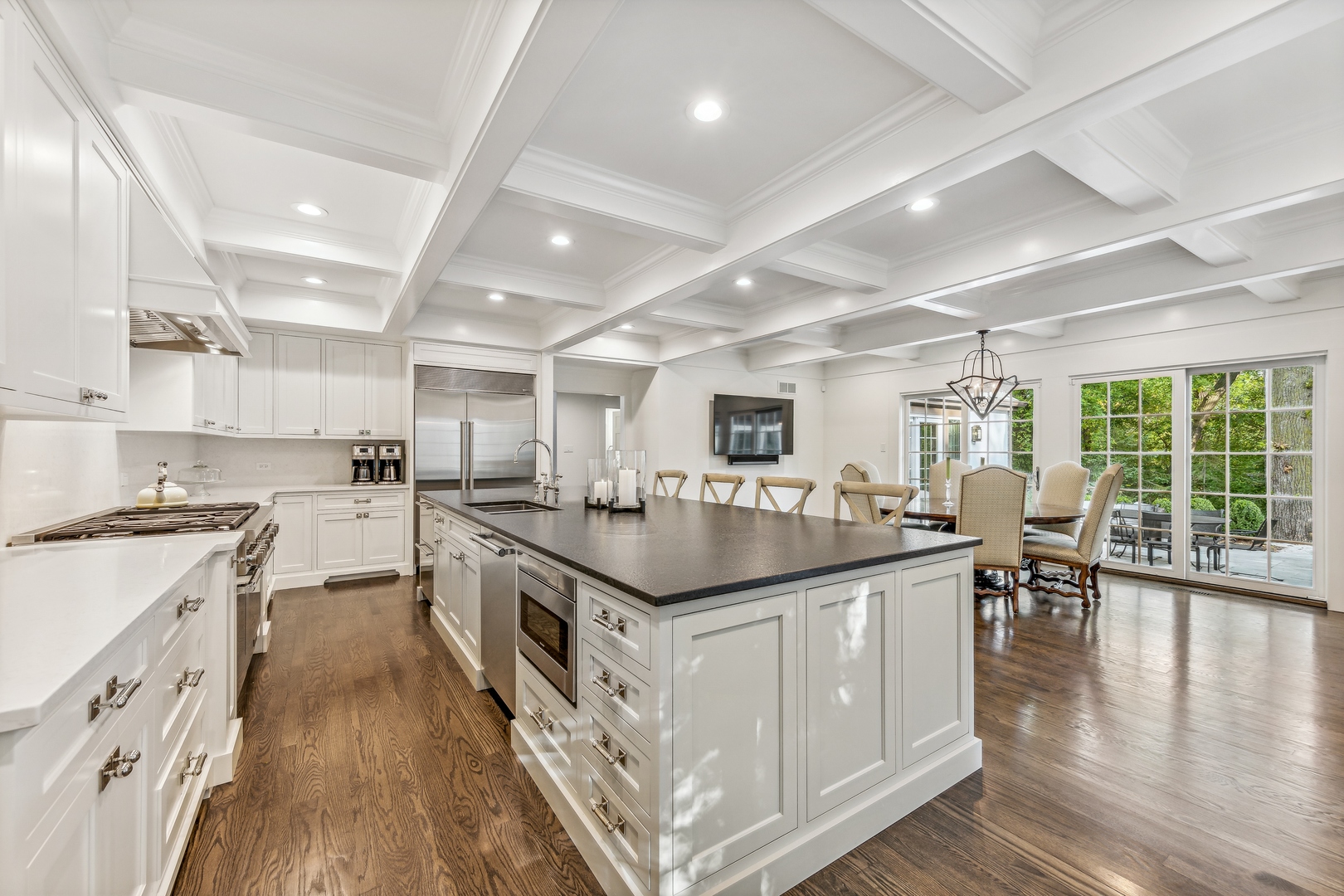 202 Burr Ridge Club Burr Ridge, IL 60527 - Photo 9 of 31 a kitchen with stainless steel appliances granite countertop a stove and a wooden floors