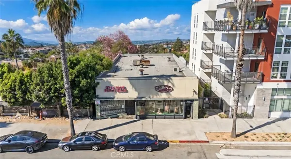 a view of a street with cars