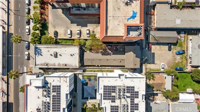 an aerial view of a large building and front view of a building