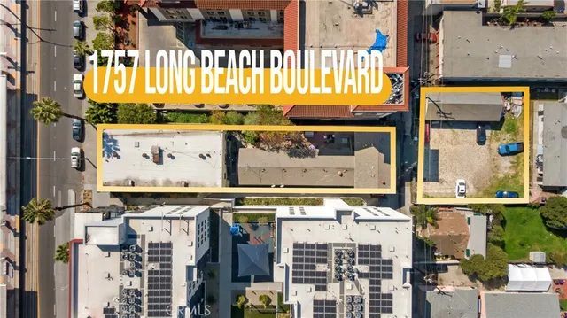 a view of a house with a small yard and wooden floor