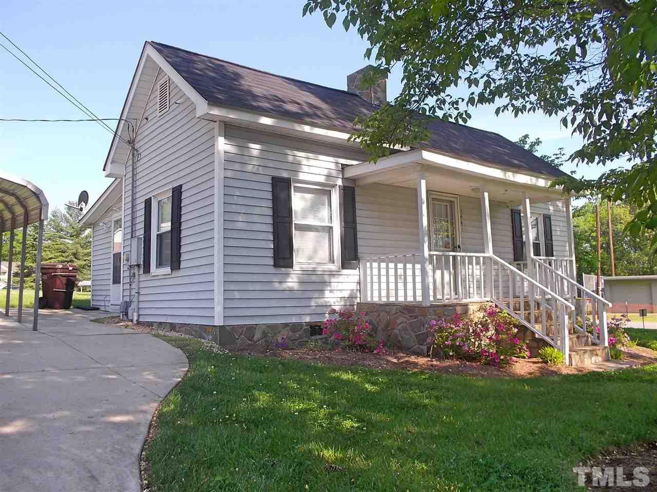 1441 Beacon Street Roxboro, NC 27573 - Photo 1 of 8 a front view of a house with a yard