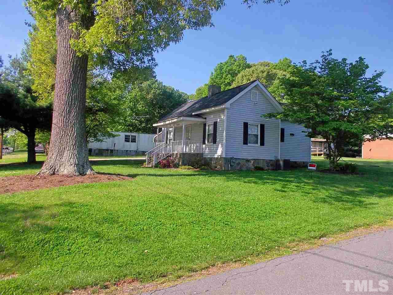 1441 Beacon Street Roxboro, NC 27573 - Photo 2 of 8 a view of house with backyard and garden