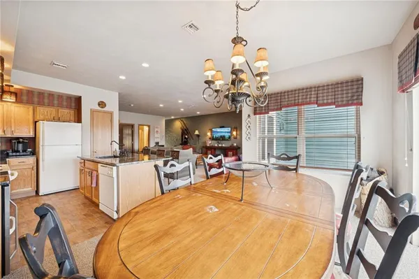 a very nice looking dining room with a table and chairs