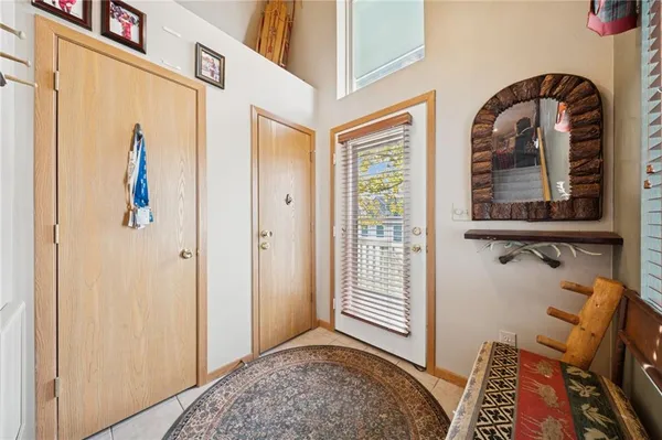 a view of an entryway with wooden floor