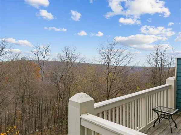 a view of balcony with wooden floor