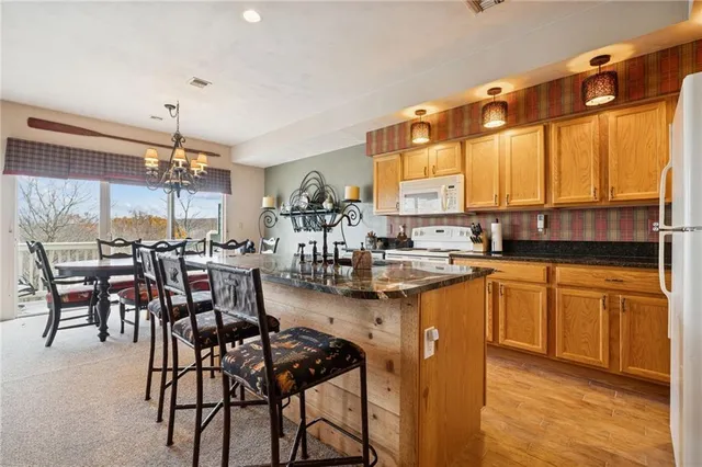a kitchen with lots of counter top space dining table and chairs
