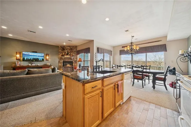 a kitchen with stainless steel appliances granite countertop a stove and a sink