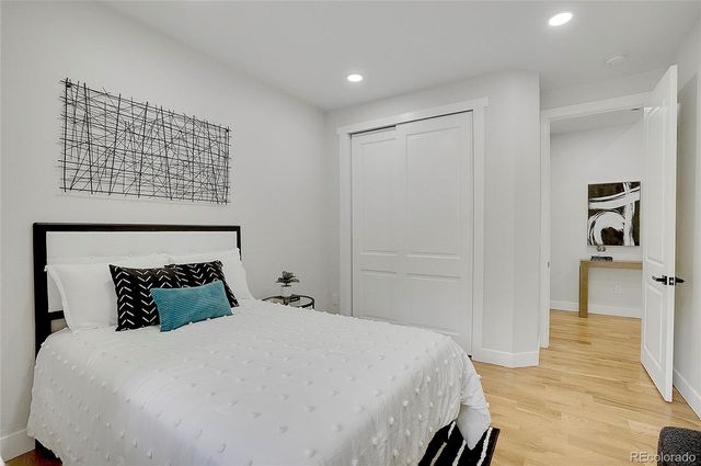 a bedroom with a bed and a walk in closet