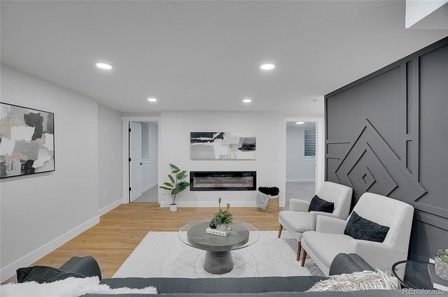 a living room with furniture and white walls